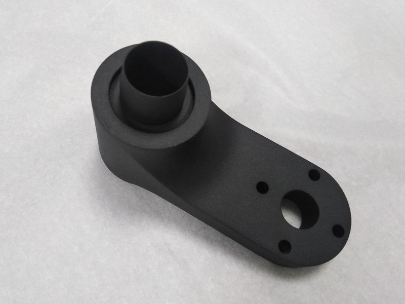 Black MJF/SLS nylon arm with tube boss — 3D printing