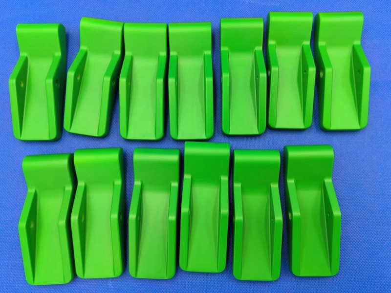 Series of 13 green 3D-printed brackets — 3D printing