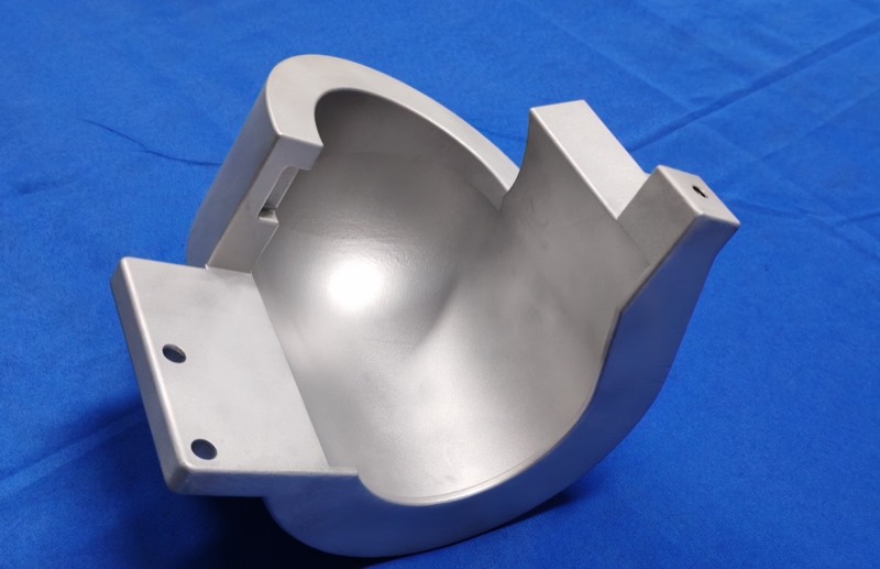 Machined aluminium part with spherical pocket — CNC machining