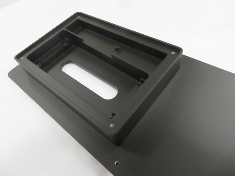Black anodised aluminium frame with brass inserts — CNC machining