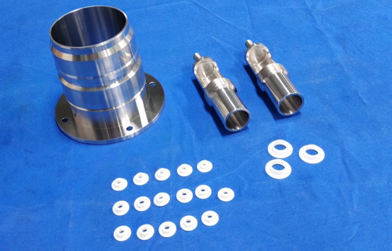 Turned stainless steel sleeve and threaded elbow fittings — CNC machining