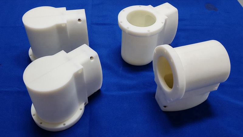 White POM machined housings — CNC machining