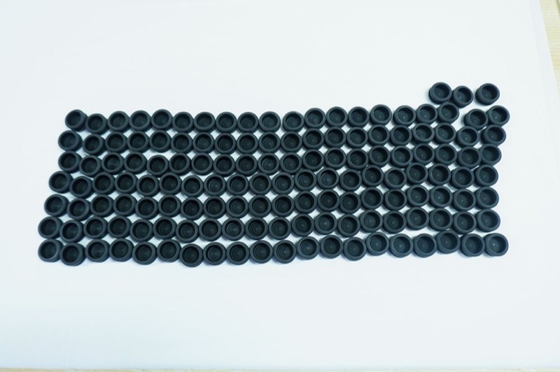 Series of black moulded rubber grommets — Injection moulding