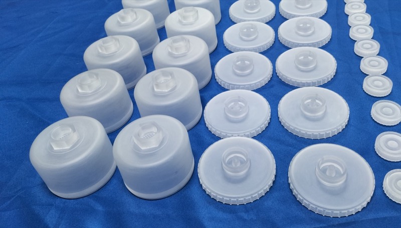 Frosted injection-moulded PP caps in three sizes — Injection moulding