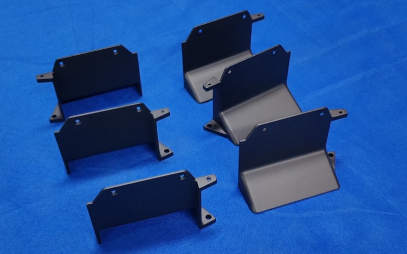 Black powder-coated bent sheet metal brackets — Factory-direct