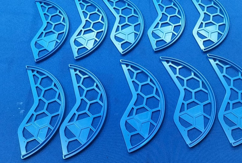 Series of blue 3D-printed honeycomb lattice parts — More projects