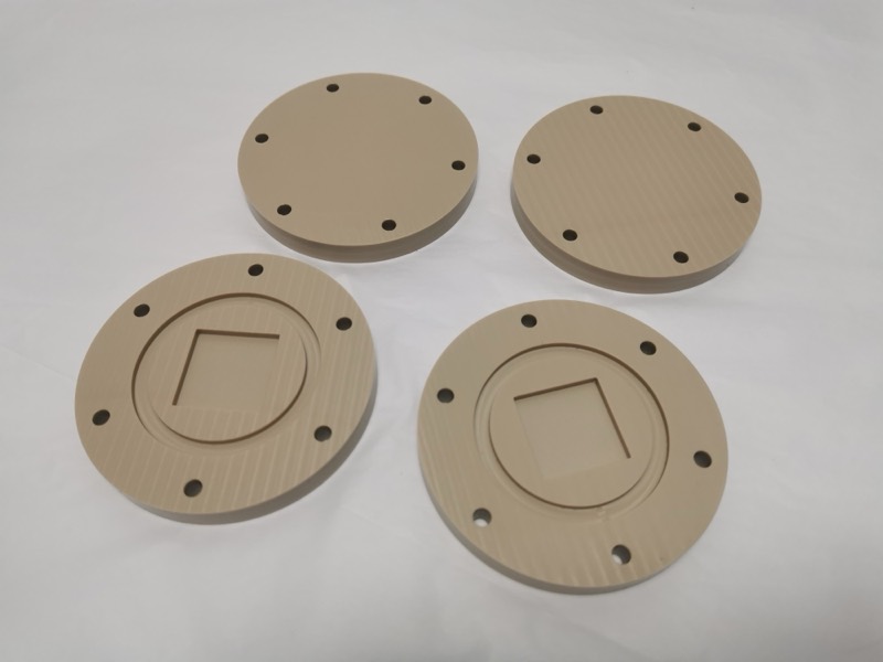 Machined PEEK discs with pockets and bolt holes — More projects