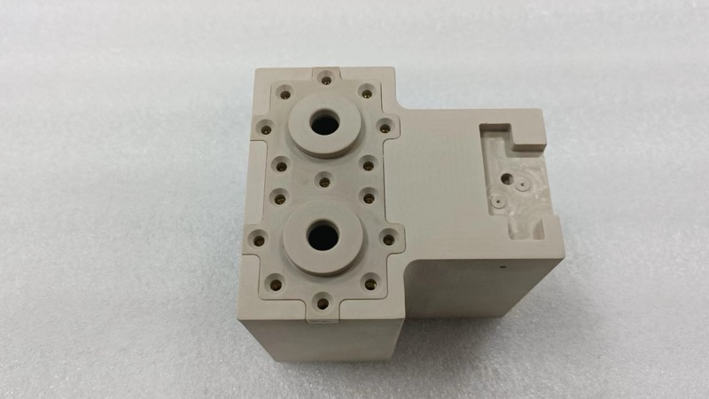 Machined PEEK manifold block with brass inserts — More projects