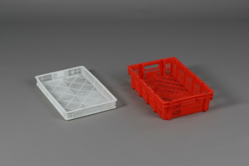 White and red perforated thermoformed plastic crates — Thermoforming